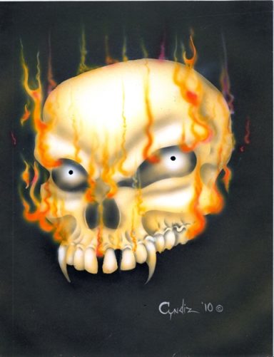 A stylized skull surrounded by flames with glowing eyes and sharp teeth.