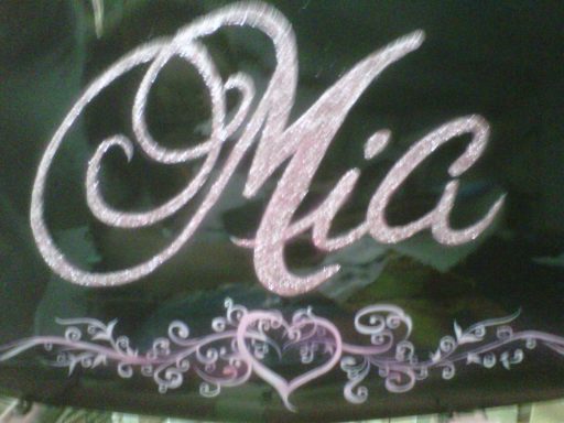 A decorative name "Mia" in elegant script with floral embellishments.